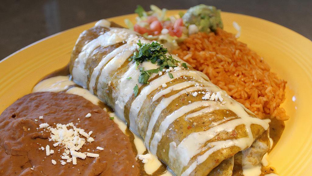 Grande · Choice of All Natural Grilled Chicken,
Seasoned Ground Beef or Pork / Mixed Cheeses / 
Shredded Lettuce / Refried Beans / Green Chile (Spicy) or Hatch Red Chile (Mild) / Salsa Fresca / Add Marinated Steak +4