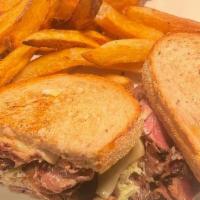 Reuben Sandwich · Corned beef, russian dressing, swiss cheese and sauerkraut grilled on seeded rye and your ch...