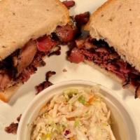 Hot Pastrami · Zaidy's pastrami on homemade seeded rye bread with a side dish of your choice