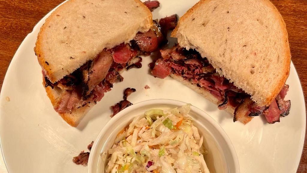 Hot Pastrami · Zaidy's pastrami on homemade seeded rye bread with a side dish of your choice