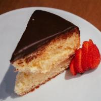 Boston Cream Pie · Rich yellow cake filled with a layer of pastry cream and chocolate frosting topped with choc...