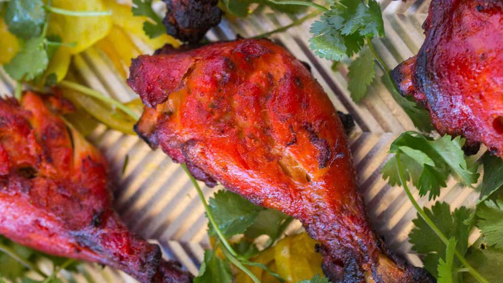 Tandoori Chicken · Chicken chunks marinated and broiled over a traditional clay oven.