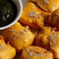 Stuffed Panner Pakora · Cubes of cheese stuffed with mint sauce fried in chickpea batter.