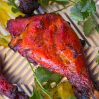 Tandoori Chicken Full · Chicken chunks marinated and broiled over a traditional clay oven.