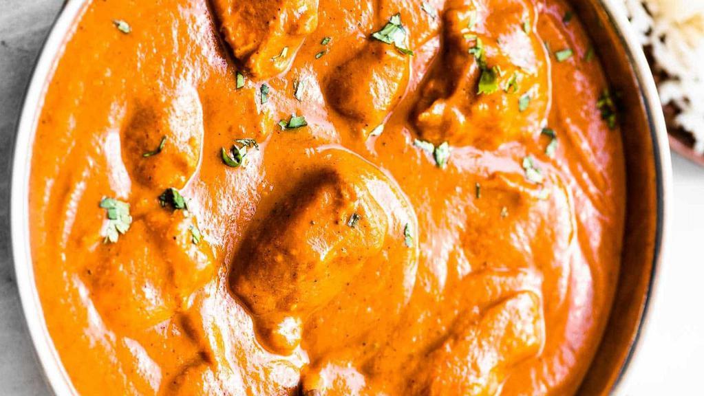 Chicken Tikka Masala · Chicken breast chunks in herbs and spices with cream. Served with basmati rice.