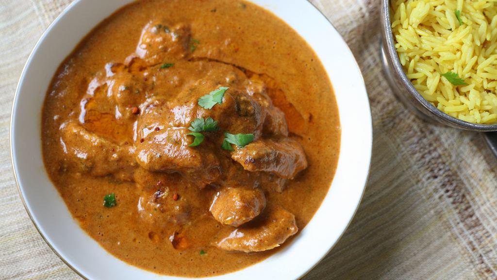 Lamb Rogan Josh · Braised lamb chunks cooked with a gravy of browned onions, yogurt, garlic, ginger, and aromatic spices. Served with basmati rice.