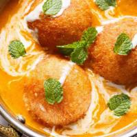 Malai Kofta · Cheese and vegetable dumplings cooked in onion, tomato, cream and almond sauce.