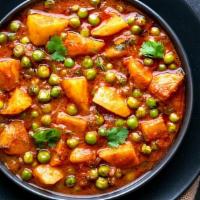 Aloo Matar · Vegetarian. Potatoes and peas sautéed with spicy tomato and onion sauce. Served with basmati...