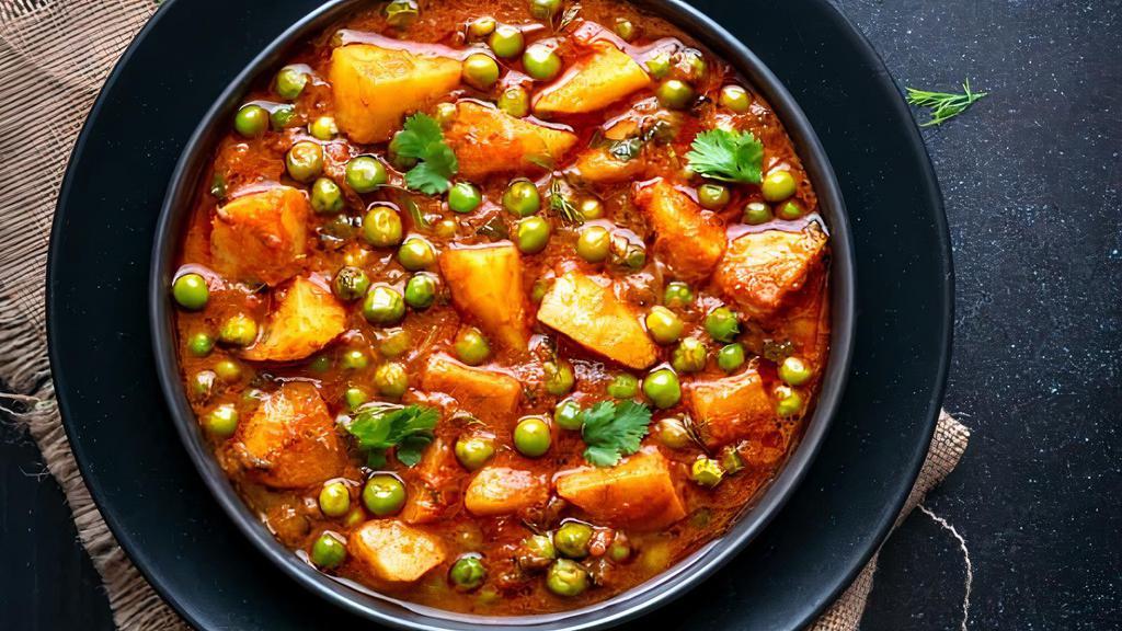 Aloo Matar · Vegetarian. Potatoes and peas sautéed with spicy tomato and onion sauce. Served with basmati rice.