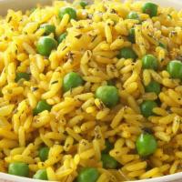 Basmati Rice Pullao · Curried basmati rice cooked with peas