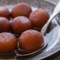 Gulab Jamun · Pastry balls served warm in cardamon and honey syrup.