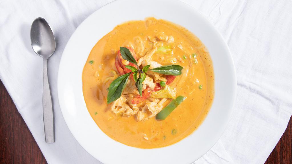 Red Curry · Spicy. Red curry, coconut milk, green peas, green and red bell peppers, bamboo shoots, cabbage, zucchini, and Thai basil.