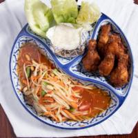 Papaya Salad Combo
 · Spicy. Contains nut. Combination of papaya salad, fried chicken, and sticky rice.