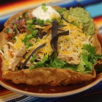Taco Salad · Your choice of chicken, beef, or beans, served with guacamole, sour cream, pico de gallo, an...