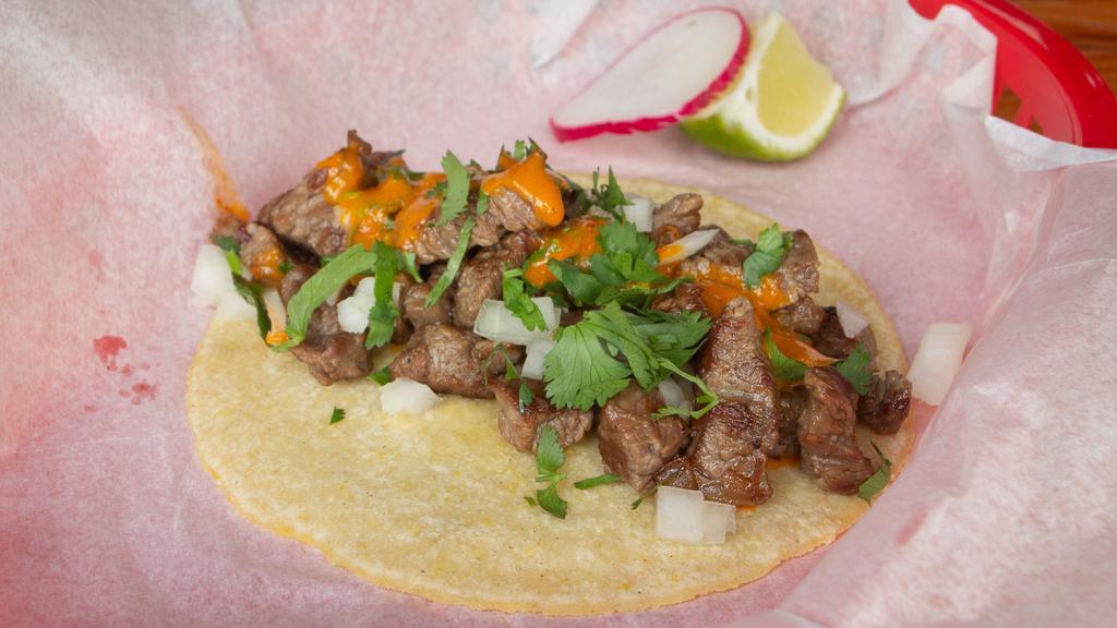 Carne Asada · Cascade Farms chopped flank steak, served traditional style with grilled onion and topped with spicy salsa de arbol, cilantro and onion

**gluten-free, may be cooked on same surface as flour tortillas**