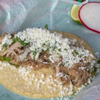 Carnitas · crispy and juicy slow cooked Cascade Farms pork topped with salsa verde, onions, cilantro an...