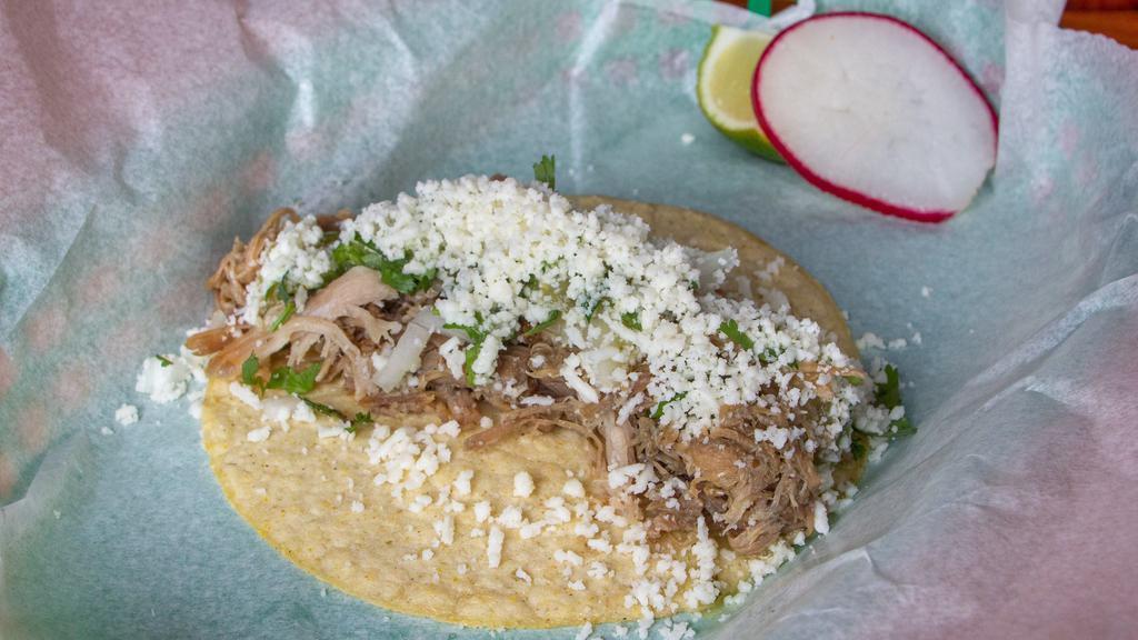 Carnitas · crispy and juicy slow cooked Cascade Farms pork topped with salsa verde, onions, cilantro and queso fresco from Ochoa Queseria

**gluten-free**