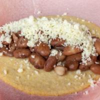 B&C Taco · pinto beans topped with your choice of queso fresco or queso Oaxaca in a housemade organic c...