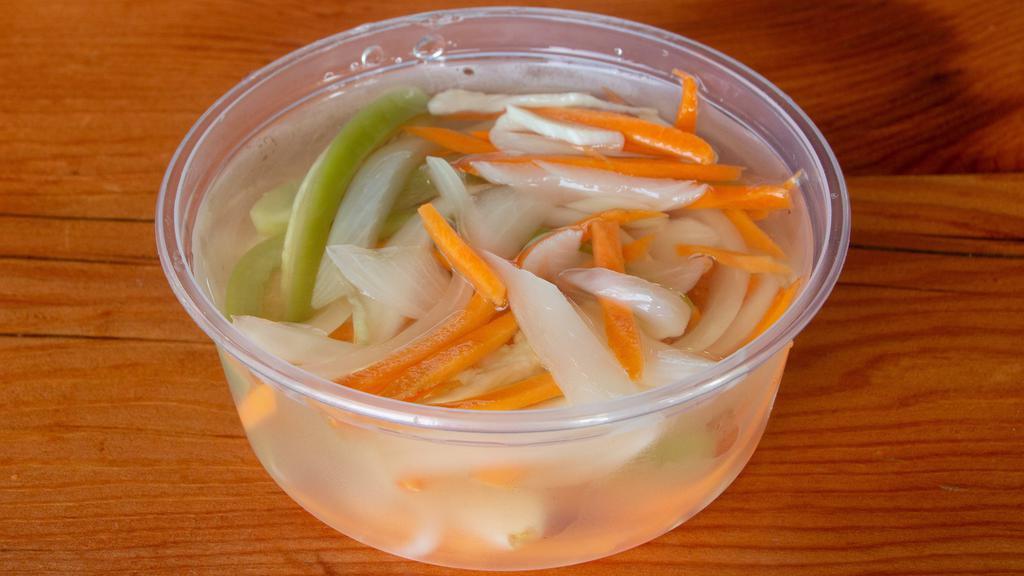 Escabeche (8Oz) · 8oz container of house escabeche: spicy pickled mix of carrots, jalapenos, onions and garlic