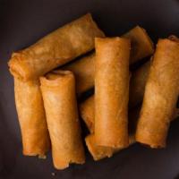 Spring Rolls (Veg) · Fried spring rolls stuffed with succulent vegetables. Served with plum sauce.