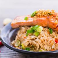 Salmon Garlic Fried Rice · Jasmine rice stir-fried in a flavorful garlic paste and eggs. Topped with pan-fried garlic b...