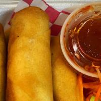 Thai Egg Rolls (5 Pieces) · Vegetarian deep fried spring rolls served with sweet chili sauce.