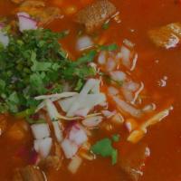 Posole · Cooked bone-in pork hominy and simmered with special red chili sauce, served with diced onio...