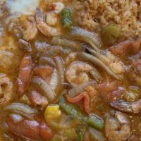 Camarones Rancheros · Prawns served with bell peppers, onions, and tomatoes in a special ranchero sauce.