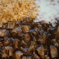 Mole Poblano · Boneless chicken breast cooked to excellence and simmered in dark chocolate sauce. Not serve...