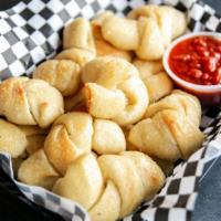 Garlic Knots · A great way to get started, please enjoy our deliciously famous garlic knots!.