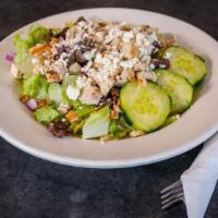 Greek Salad · Romaine, chicken, kalamata olives, feta cheese, cucumbers, and red onions.