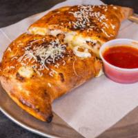 Create Your Own Calzone · Choose any four pizza toppings.
