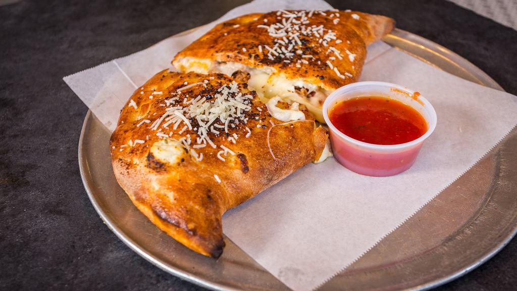 Create Your Own Calzone · Choose any four pizza toppings.