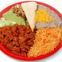 Combo #17 (Adobada Plate) · Marinated pork, lettuce, pico de gallo, guacamole, sourcream, and tortillas on the side with...