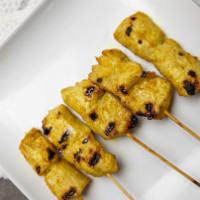 Satay Chicken  · Grilled chicken on skewers marinated with our own satay herbs and coconut sauce. Served with...