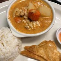 Massaman Curry · Made with coconut milk, roasted peanuts, potatoes, onions, carrots, and intense Thai spices....