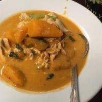 Red Curry With Pumpkin · Starts at medium spicy level. Creamy Red Curry spices with coconut milk, bell peppers, basil...
