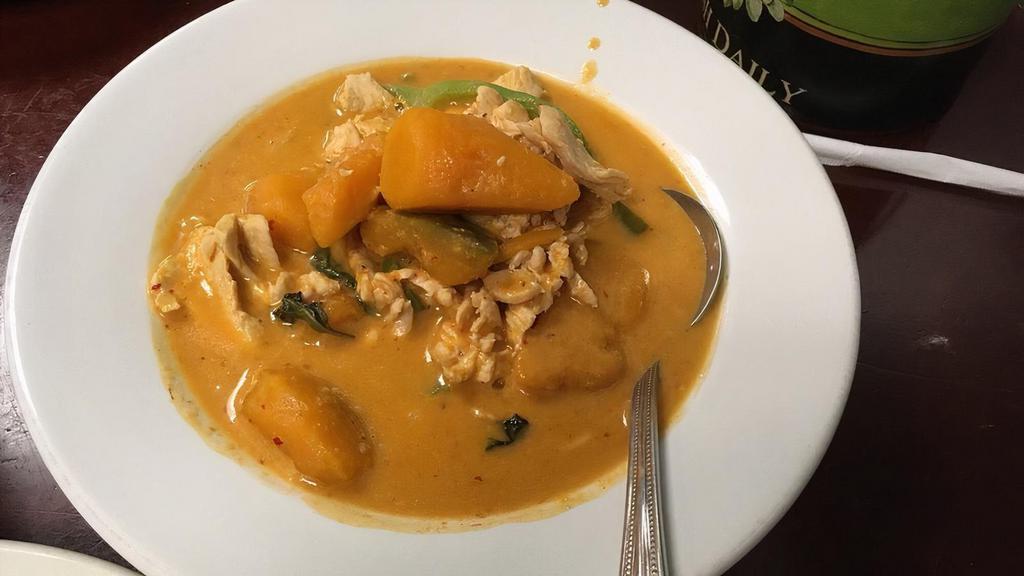 Red Curry With Pumpkin · Starts at medium spicy level. Creamy Red Curry spices with coconut milk, bell peppers, basil,  and Thai pumpkin.   Served with Jasmine rice