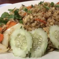 Spicy Fried Rice · Stir fried with rice, egg, onions, tomatoes, garlic, basil, and Thai chilis.