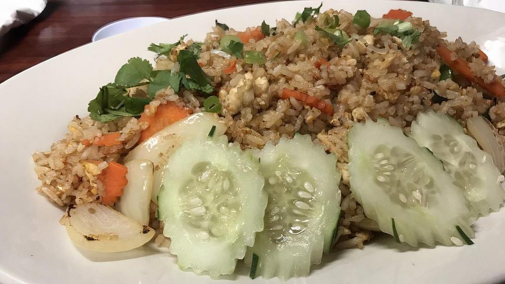 Spicy Fried Rice · Stir fried with rice, egg, onions, tomatoes, garlic, basil, and Thai chilis.
