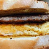 Breakfast Sandwich · Your choice of white, wheat or sourdough bread. Choice of bacon, sausage or ham with cheddar...