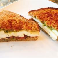 Caprese Sandwich · Pesto, fresh mozzarella, fresh basil, tomato, and a balsamic reduction on wheat bread