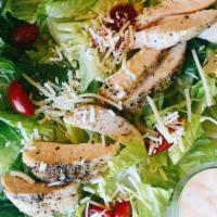Chicken Caesar Salad · 6oz baked chicken breast, romaine lettuce, tomato, Parmesan cheese and Caesar dressing
