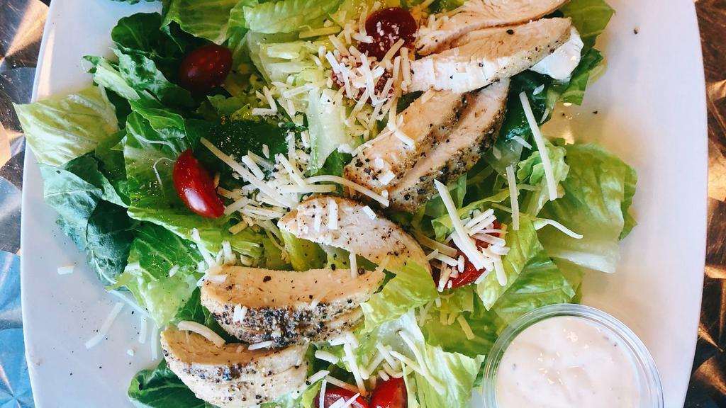 Chicken Caesar Salad · 6oz baked chicken breast, romaine lettuce, tomato, Parmesan cheese and Caesar dressing