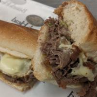 Philly Cheese Steak Sandwich · Choice ribeye steak, mushrooms, onions, green bells, white American.