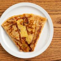 Crêpe Cadix · Spanish chorizo, Swiss cheese, potatoes with tomatoes and onion. Add 2 Eggs for an additiona...