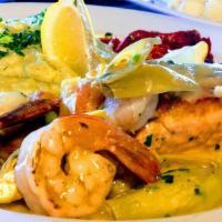 Salmon Fillet · Pan seared, salmon fillet served with sautéed shrimp and artichokes in lemon garlic white wi...