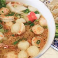 Seafood Egg Noodle Soup / Mi Đồ Biển · Egg noodles soup with shrimp, squid, imitation crab and fish balls in pork broth.