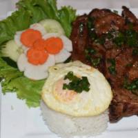 Grilled Pork Chop Platter · Gluten-free. Grilled pork chop served with a sunny side up egg and rice.