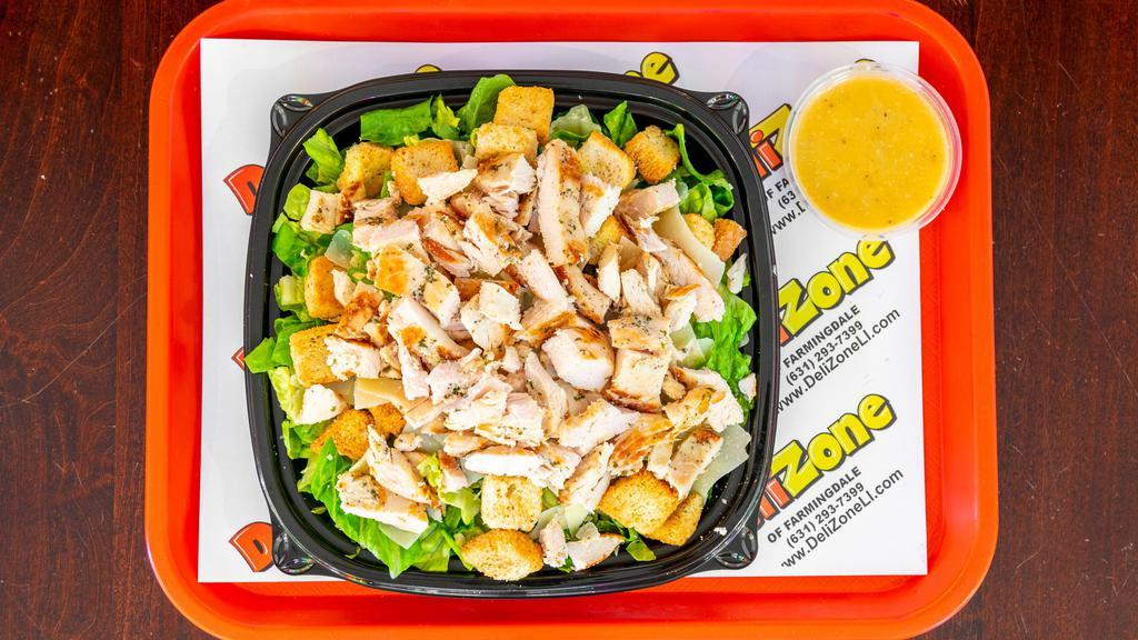 Chicken Caesar Salad · Romaine lettuce, Grilled Chicken, Parmesan cheese, and croutons. Served with Caesar dressing.